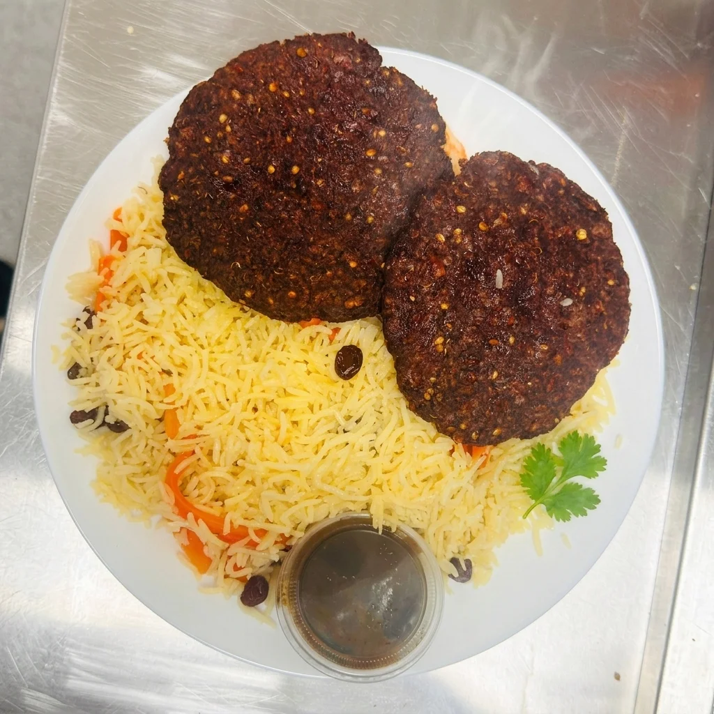 Beef Chapli Kebab with Kabuli Pulao rice at Chenab Pakistani Restaurant Edmonton